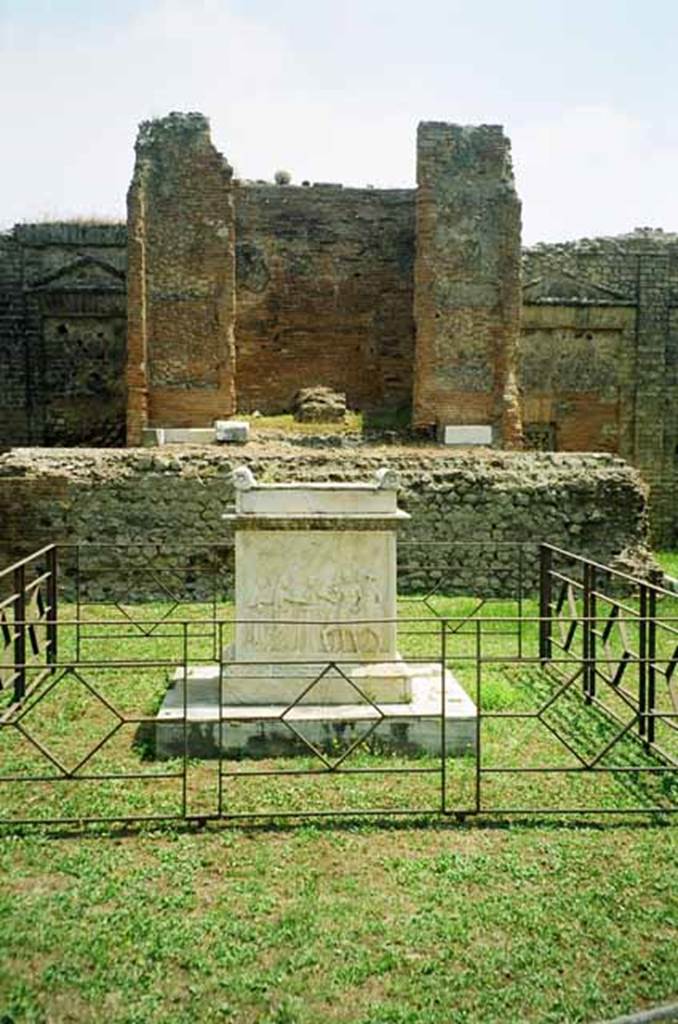 VII.9.2 Pompeii. July 2010. Altar, with low diamond pattern fence, cella and podium.
Photo courtesy of Rick Bauer.