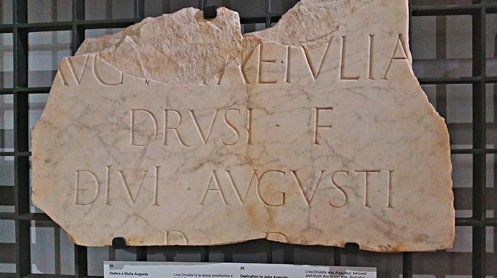 Marble inscription, dedication to Julia Augusta from the Forum area, probably from the so-called Temple of the Lares, 14-42 AD.
The inscription would have read –
“To the Augusta Julia, daughter of Drusus, wife of the divine Augustus, by decree of the decurions”.
Now in Naples Archaeological Museum, inv. 3815, (CIL X, 799).
Photo courtesy of Giuseppe Ciaramella.