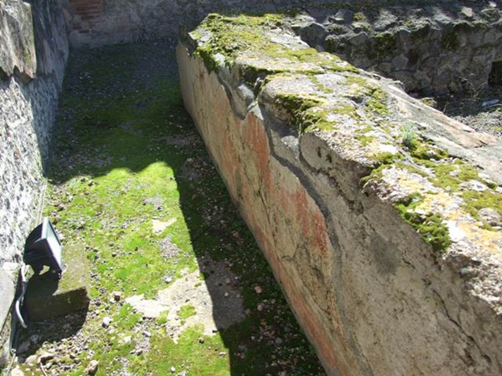VII.9.7 and VII.9.8 Pompeii. Macellum. March 2009.
Looking south along east (rear) side of counter towards south-east corner.