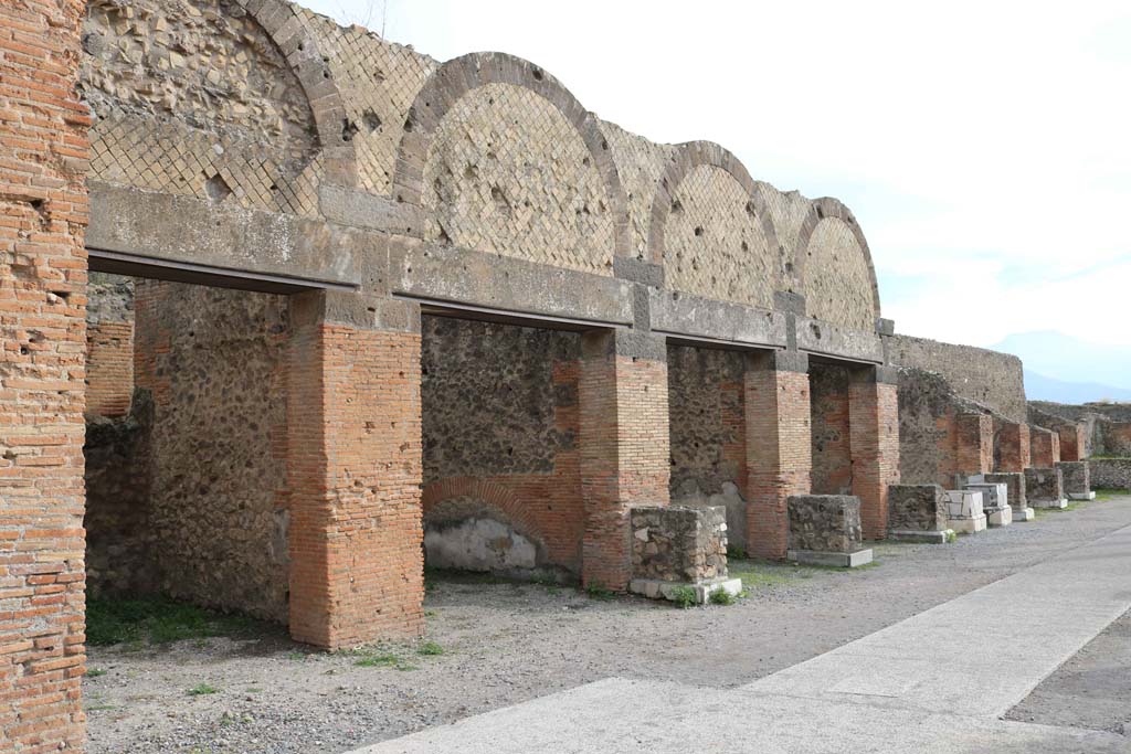 VII.9.12 Pompeii, on left. December 2108.
Looking south along shop doorways on east side of Forum, in north-east corner. Photo courtesy of Aude Durand.