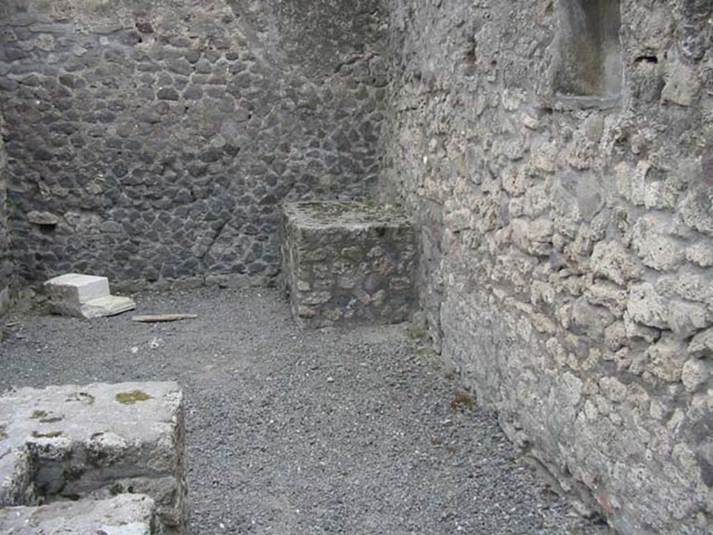VII.9.22 Pompeii. May 2003.
Looking towards the south wall and south-west corner from the hearth at the rear of the counter. Photo courtesy of Nicolas Monteix.