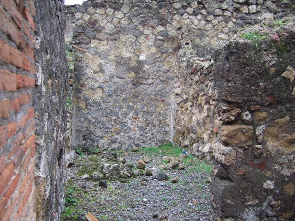 VII.9.32 Pompeii. December 2005. Site of steps to upper floor, at front.
At rear is a room on the north side of the atrium of VII.9.33, looking west.