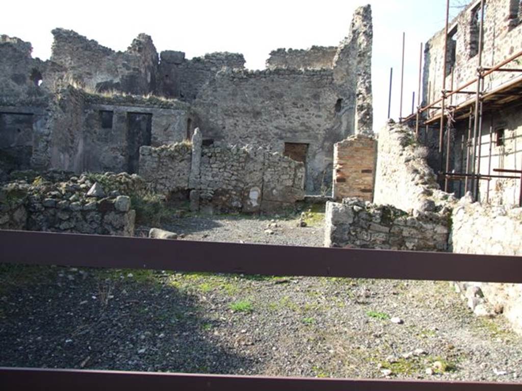VII.10.10 Pompeii. December 2007. Looking west across shop towards doorway to rear room.