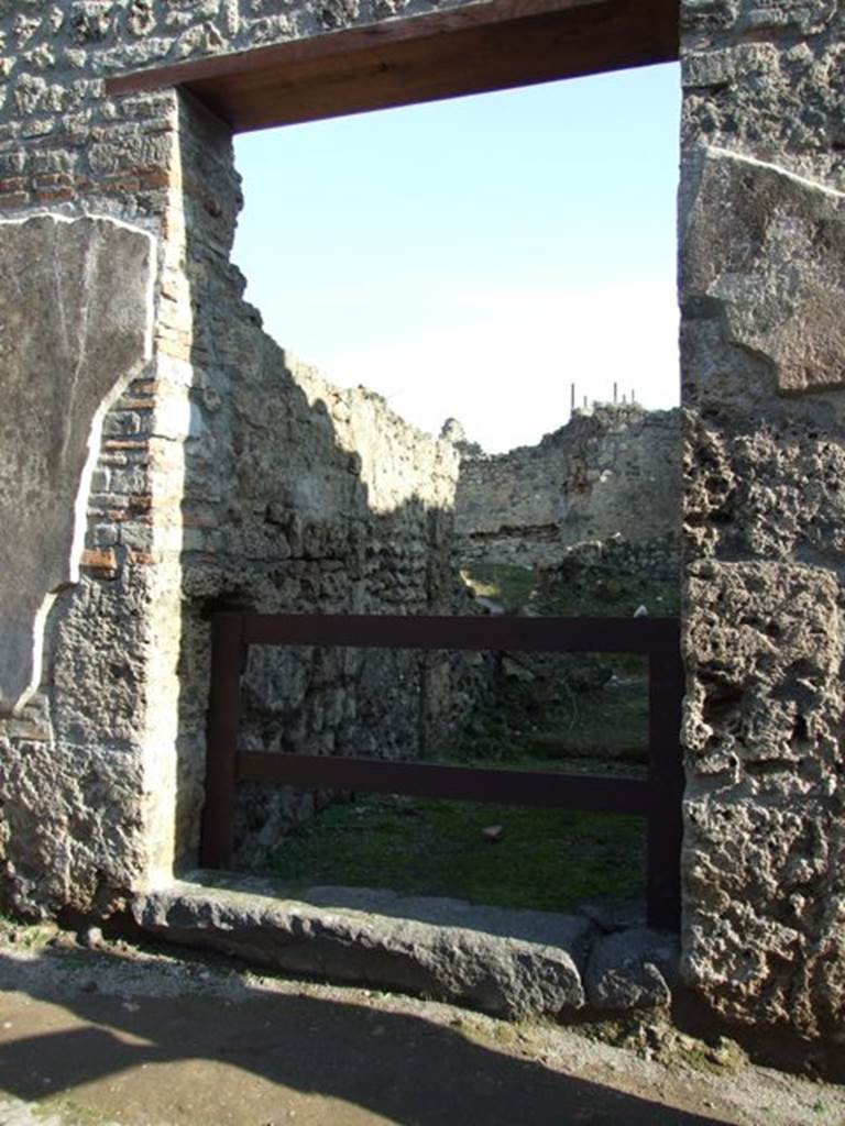 VII.11.2 Pompeii. December 2007. Entrance. According to Boyce, between the two entrances, on the pilaster on the left side above, Mercury was painted with an animal by his side. Helbig thought it resembled a dog more than a ram. Frohlich described it as vanished and destroyed.
See Boyce G. K., 1937. Corpus of the Lararia of Pompeii. Rome: MAAR 14. (p.111, no.20)
See Helbig, W., 1868. Wandgemälde der vom Vesuv verschütteten Städte Campaniens. Leipzig: Breitkopf und Härtel. (12)
See Fröhlich, T., 1991. Lararien und Fassadenbilder in den Vesuvstädten. Mainz: von Zabern. (F56)