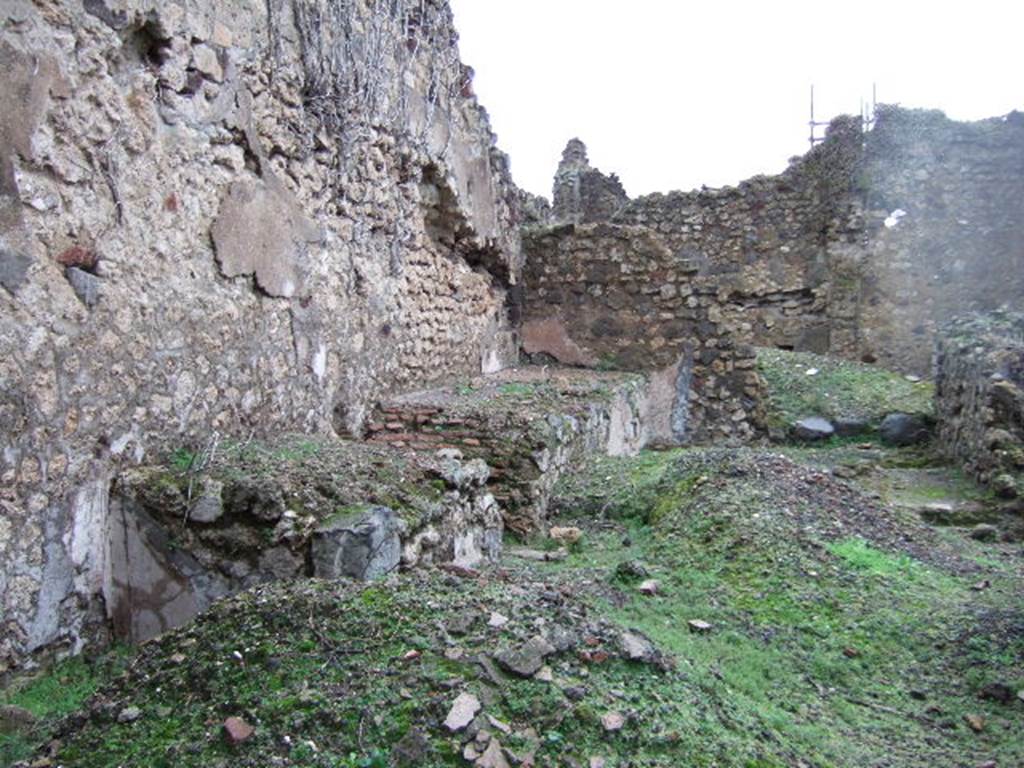 VII.11.3 Pompeii. December 2005. North wall with podium.