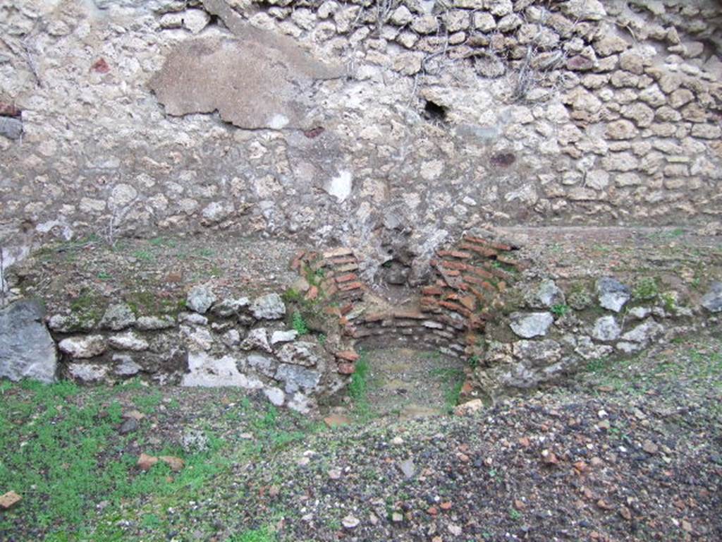 VII.11.3 Pompeii. December 2005. North wall. Hearth and space for cauldron or tub.