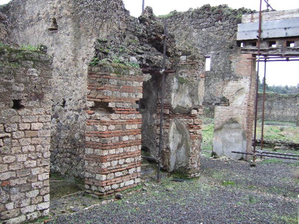 VII.11.6 Pompeii. December 2005. Looking south-east towards doorways to rooms on east side of atrium.