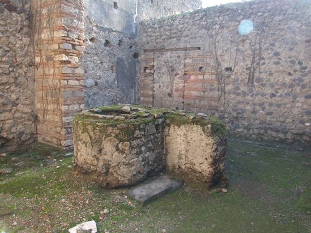 VII.11.7 Pompeii. December 2007. Looking south-east across masonry trough to back room.
According to PPM, the door to the house at number 6, later closed in opus incertum, is located in the south wall.
In the east wall are the holes for the floor joists and remains of the decoration, now faded, of the first floor.
See Carratelli, G. P., 1990-2003. Pompei: Pitture e Mosaici. Roma: Istituto della enciclopedia italiana., VII, p. 453-5.