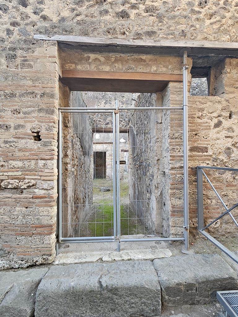 VII.11.11 Pompeii. November 2024.
Looking south through entrance doorway. Photo courtesy of Annette Haug.