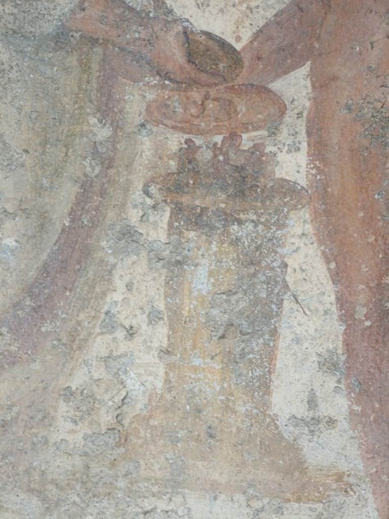 VII.11.14 Pompeii. March 2009. Garden “C”, detail of altar on lararium.
Jupiter and the Genius both hold a patera in their hand.