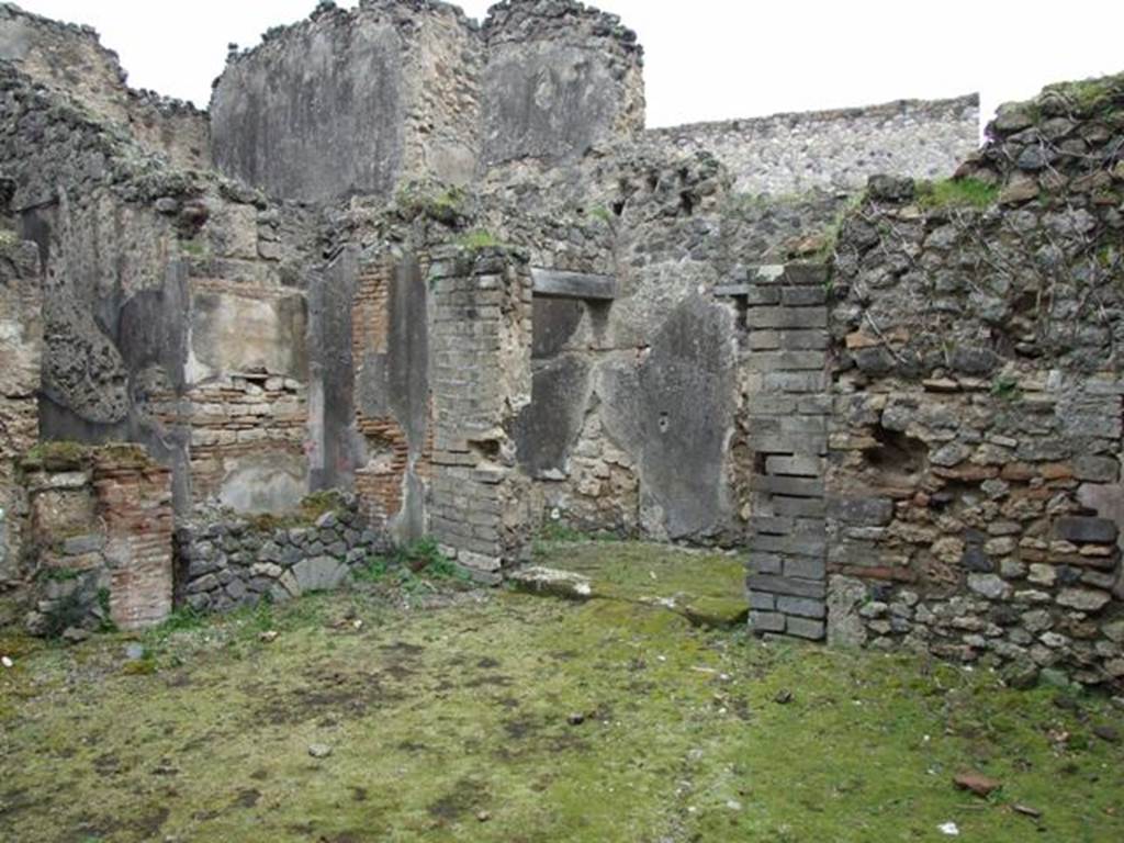 VII.11.14 Pompeii. March 2009. North east corner of Garden area “A”, with step to entrance passageway, Room 1.