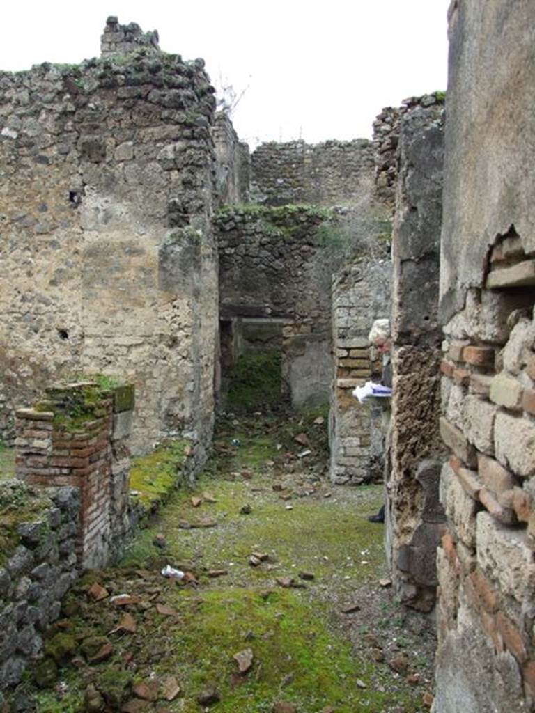 VII.11.14 Pompeii. March 2009. Passageway. Room 1. Looking west towards Rooms 5 and 6.
