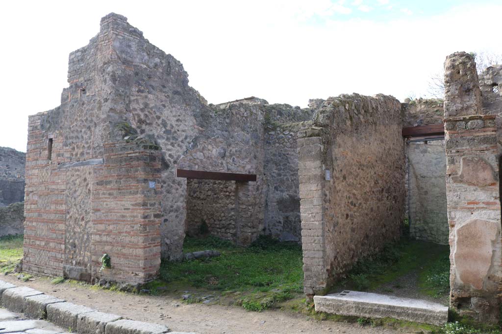 VII.11.15 Pompeii on left. December 2018.
Looking south-west to entrances on west side of Vicolo del Lupanare. Photo courtesy of Aude Durand.