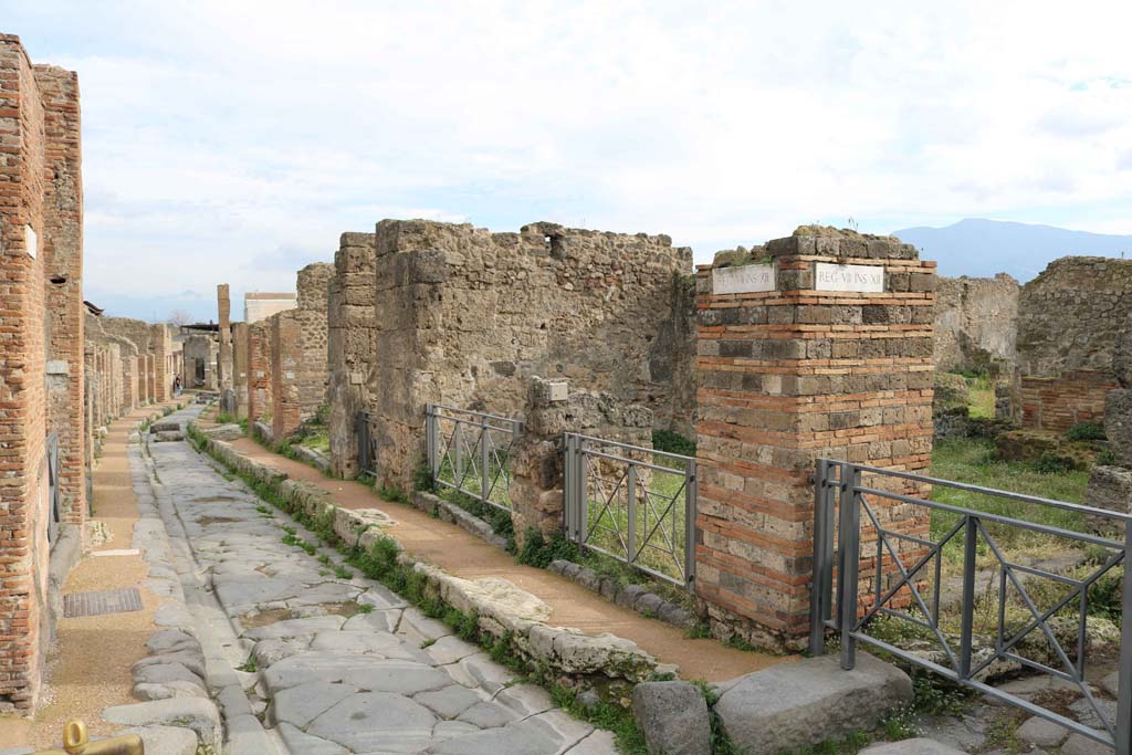 Via degli Augustali Pompeii, looking east. December 2018.
The entrance doorway at VII.12.1 is right of centre. Photo courtesy of Aude Durand.