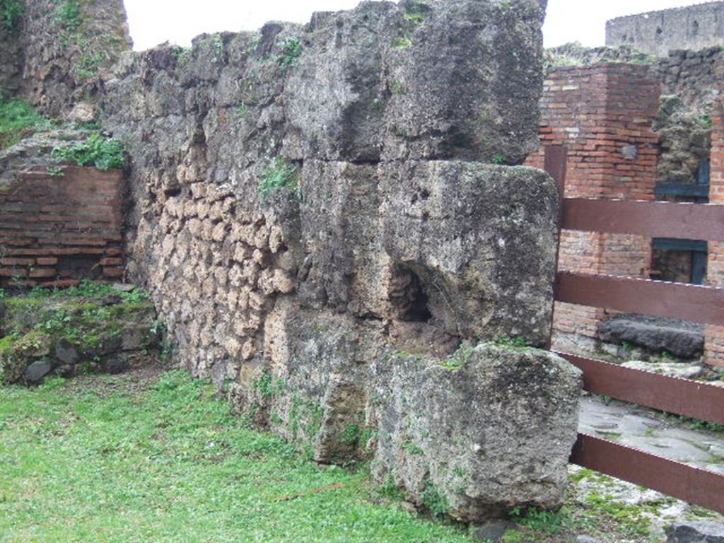 VII.12.1 Pompeii and VII.12.37. December 2004. West wall and VII.12.37.