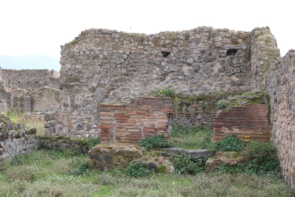 VII.12.1, Pompeii. December 2018.
Looking towards oven. The west wall with doorway at VII.12.37 doorway, is on the right. Photo courtesy of Aude Durand.