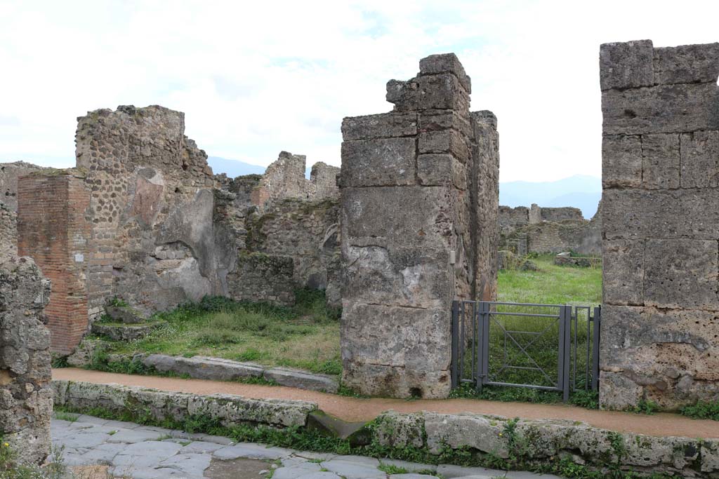 VII.12.4 Pompeii on left and VII.12.3 on right. December 2018.
Looking south on Via degli Augustali towards doorways. Photo courtesy of Aude Durand.