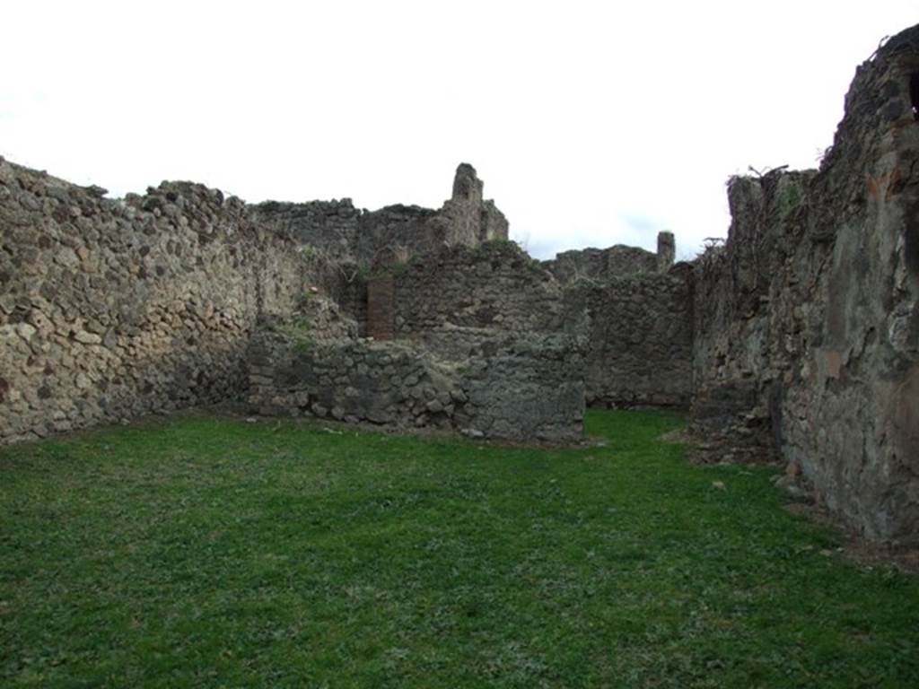 VII.12.5 Pompeii. December 2007. South wall with doorway to rear room.