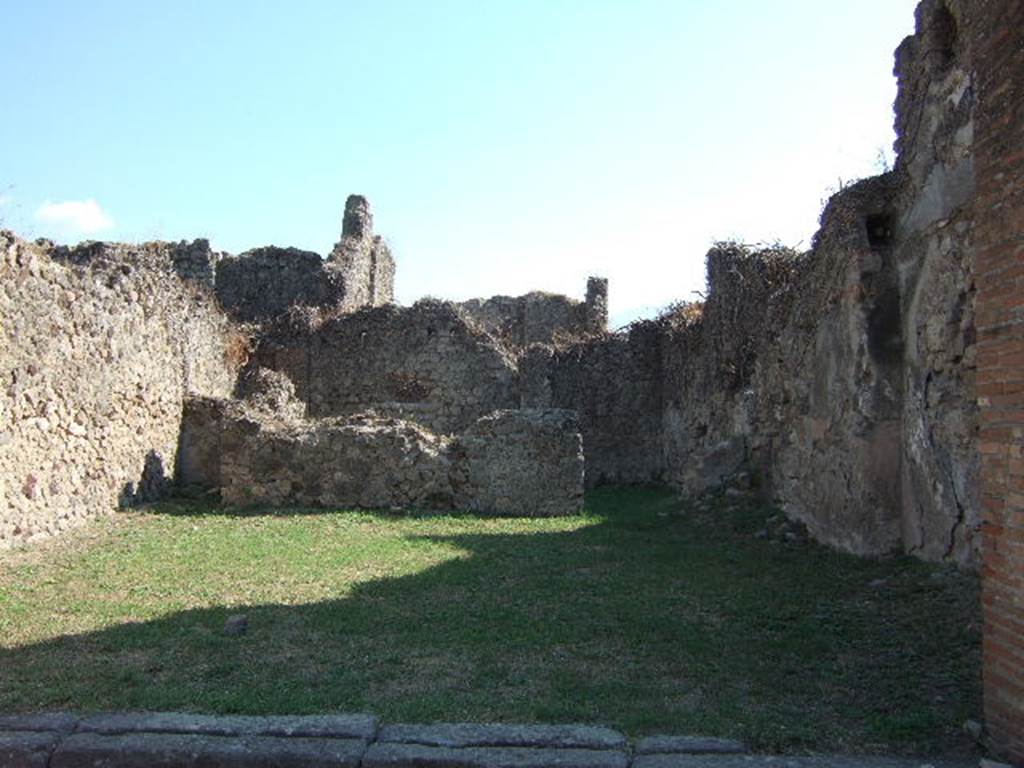 VII.12.5 Pompeii. September 2005. South wall with doorway to rear room.