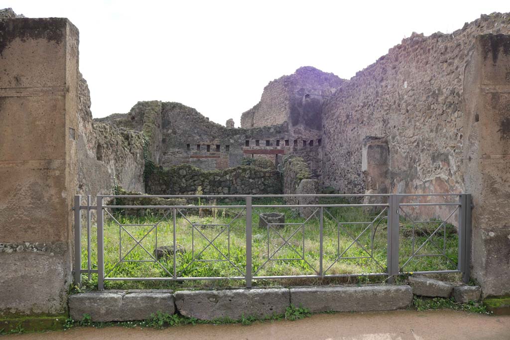 VII.12.11 Pompeii. December 2018.
Looking south across workshop towards rear room with corridor to rear on right. Photo courtesy of Aude Durand.