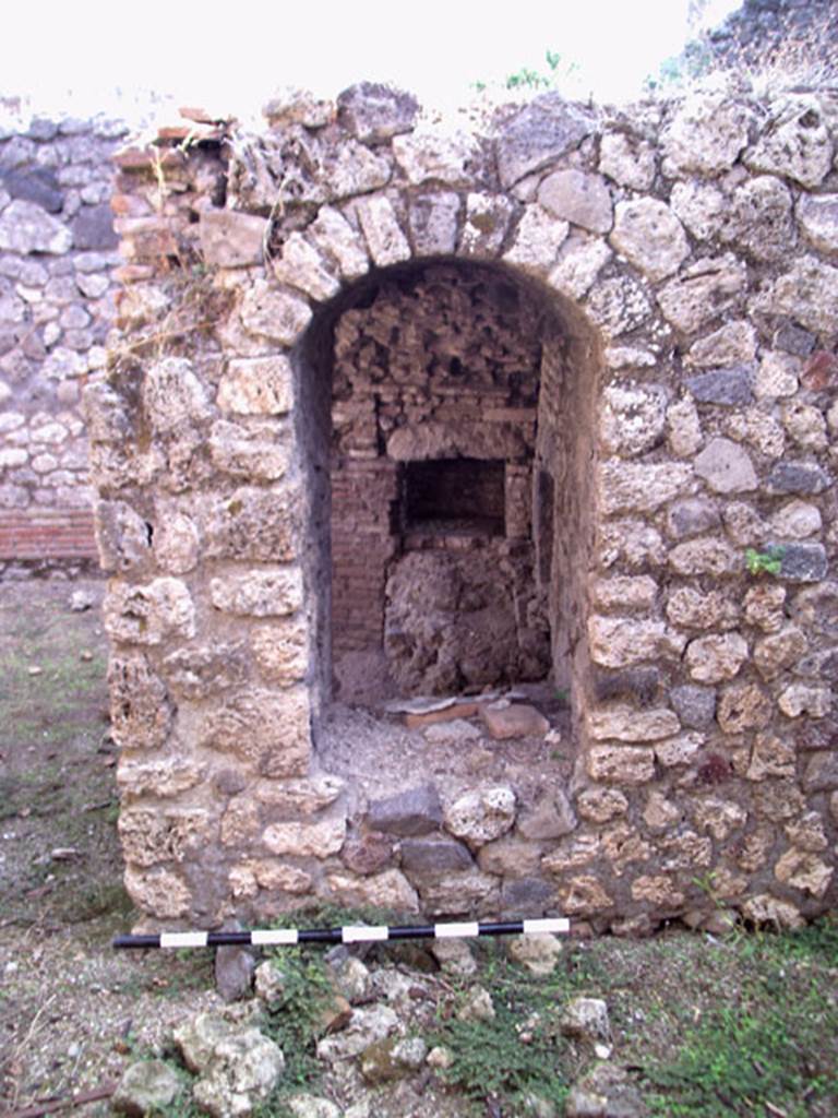 VII.12.11 Pompeii. July 2008. Looking east through oven, from room on west side. Photo courtesy of Jared Benton.