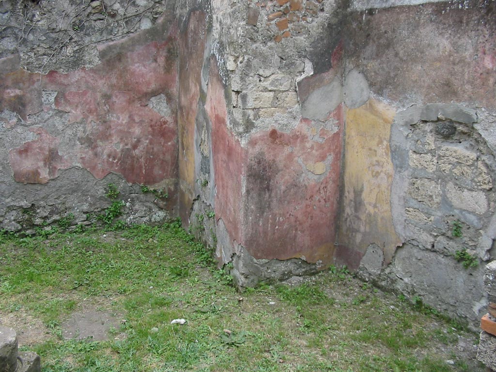 VII.12.15 Pompeii. May 2003. South-west corner of triclinium/rear room.
The remaining painted walls would appear to show alternating red and yellow panels. Photo courtesy of Nicolas Monteix