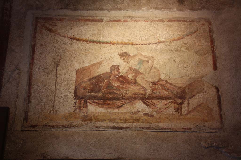 VII.12.18 Pompeii. April 2014. Painted erotic wall fresco on frieze. Photo courtesy of Klaus Heese.