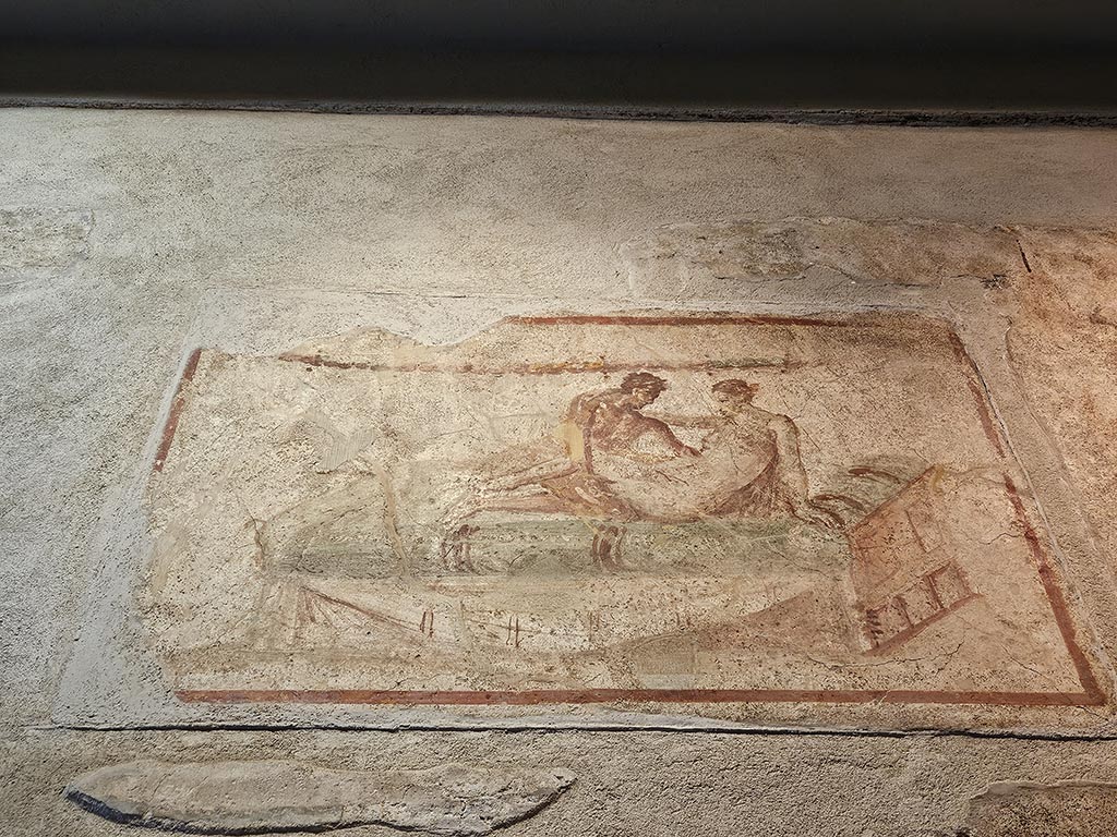 VII.12.18 Pompeii. November 2024. Painted erotic wall fresco on frieze. Photo courtesy of Annette Haug.