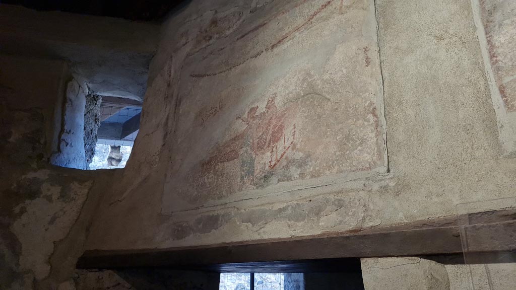 VI.12.18 Pompeii. April 2022.
Erotic wall paintings on frieze on west wall above doorway to latrine. Photo courtesy of Giuseppe Ciaramella.
