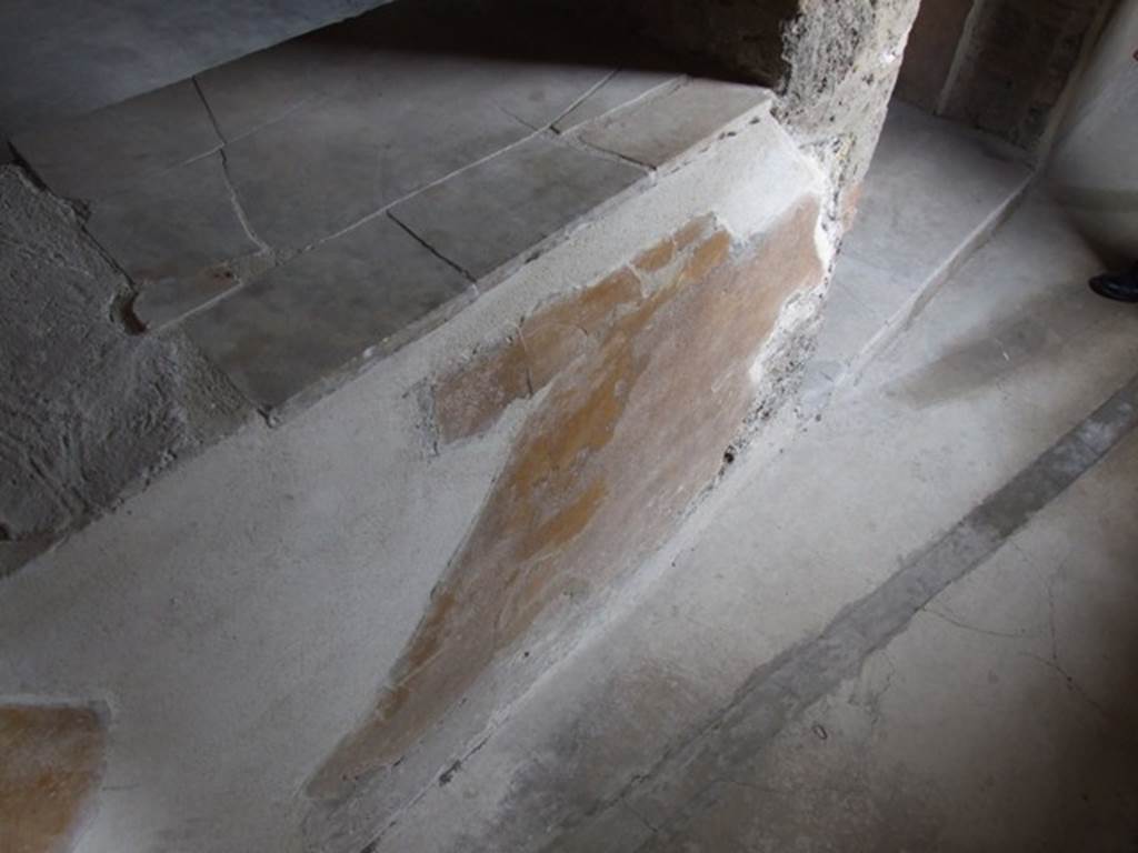 VII.12.20 Pompeii. March 2009. Remains of painted plaster under window sill of Room 4.