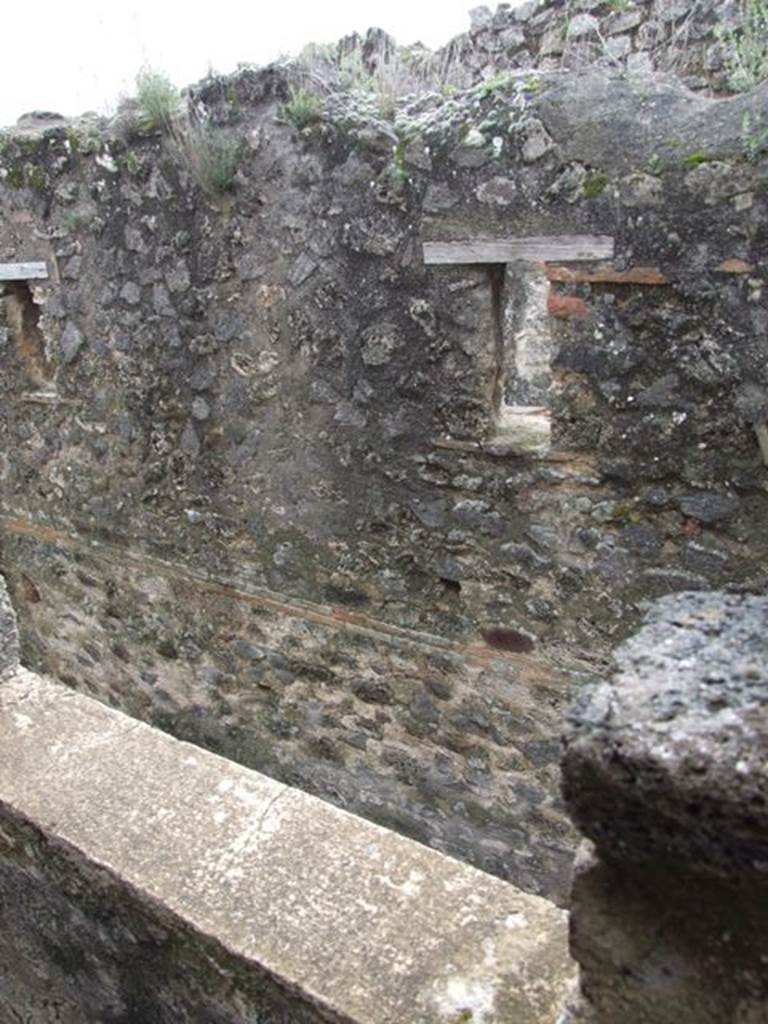 VII.12.20 Pompeii. March 2009. Looking out of window at small windows opposite in upper wall of VII.11.11.