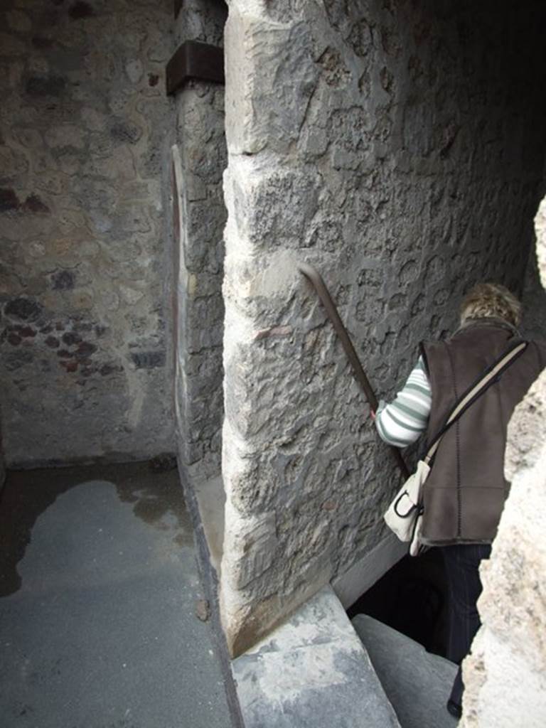 VII.12.20 Pompeii. March 2009. West end of corridor, with staircase down to lower floor, and door to Room 5.