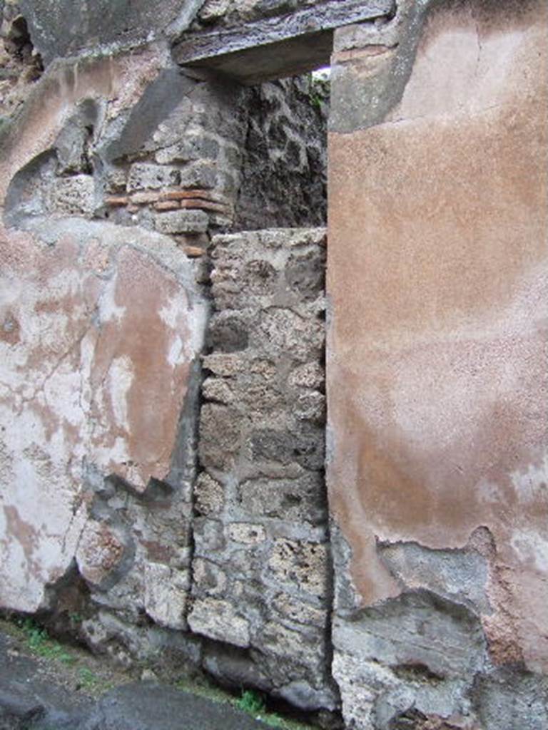 VII.12.22 Pompeii. Entrance to workshop with steps to upper floor. December 2005. Blocked entrance.