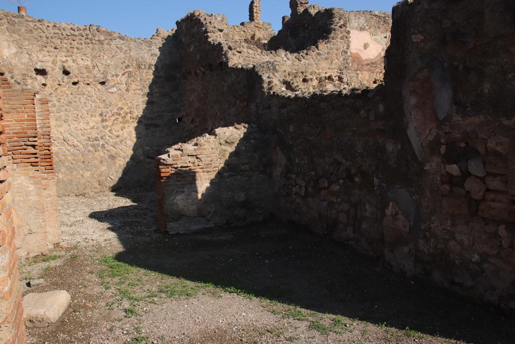 VII.14.1 Pompeii. October 2022.
Looking north across shop to doorway to rear room, with entrance at VII.14.20 in its west wall. Photo courtesy of Klaus Heese.