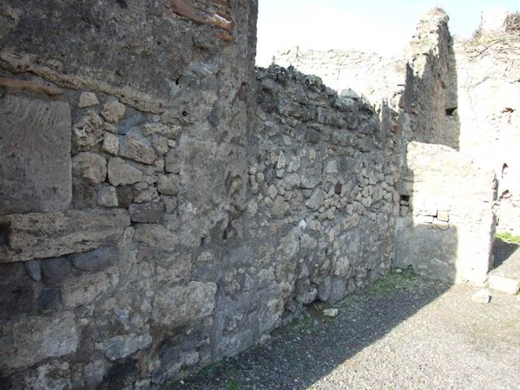 VII.14.2 Pompeii. December 2007. West wall of shop.