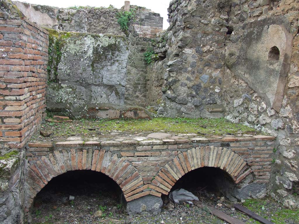 VII.14.5 Pompeii. March 2009. Room 18, hearth or bench.