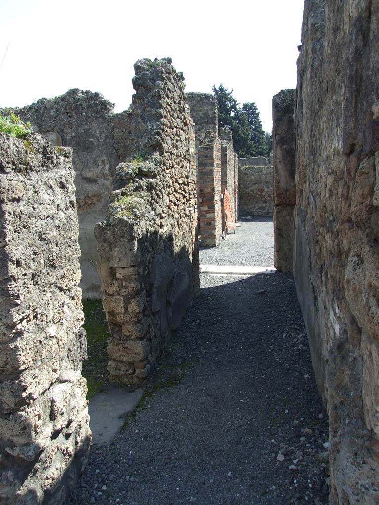VII.14.9 Pompeii. March 2009.
Room 11, looking south along corridor to atrium, with doorway in east wall to room 12.