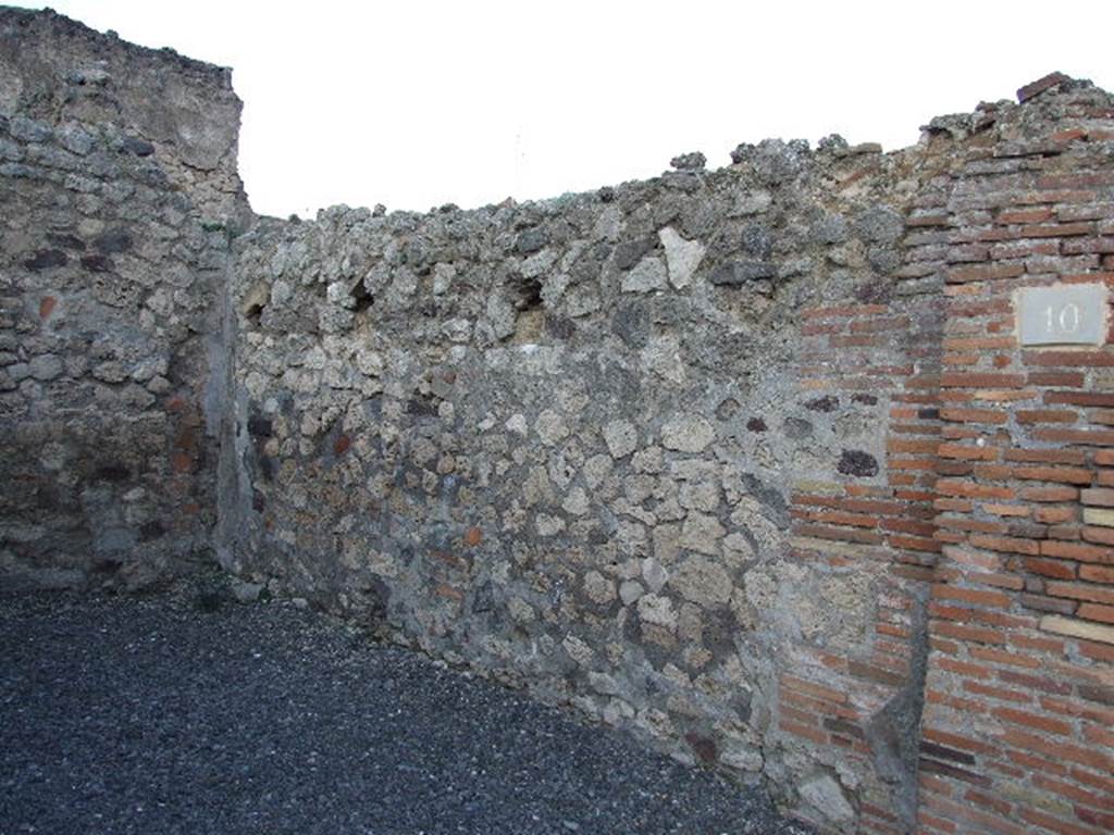 VII.14.10 Pompeii. May 2006. East wall and north-east corner of shop-room.