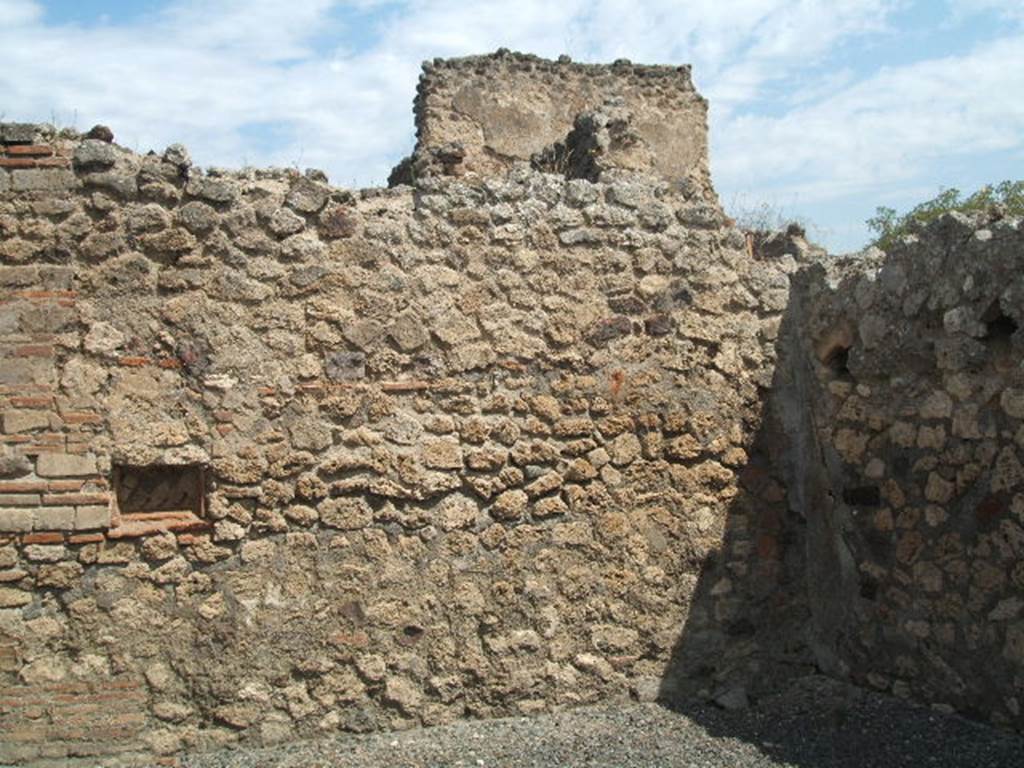 VII.14.10 Pompeii. May 2005. North wall of shop-room.