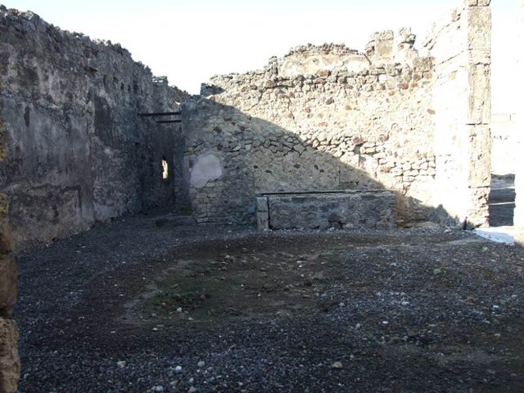 VII.15.1 Pompeii. December 2007. Atrium looking north to corridor leading to rear of house and latrine. A masonry platform base is on the north wall.