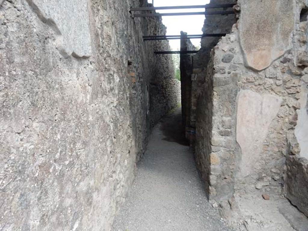 VII.15.1 Pompeii. May 2018. Corridor in north-west corner of atrium leading north to rear of house and site of latrine. Photo courtesy of Buzz Ferebee.