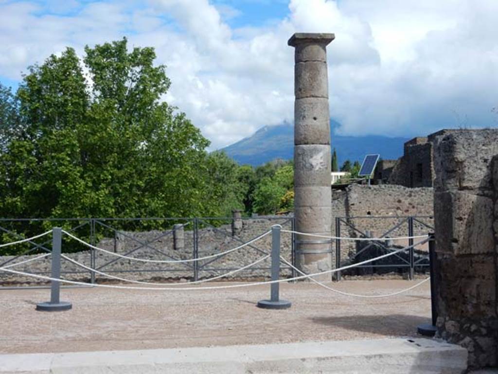 VII.15.2 Pompeii. May 2018. Looking north-east from tablinum onto south portico, with Vesuvius hidden in the clouds. Photo courtesy of Buzz Ferebee.