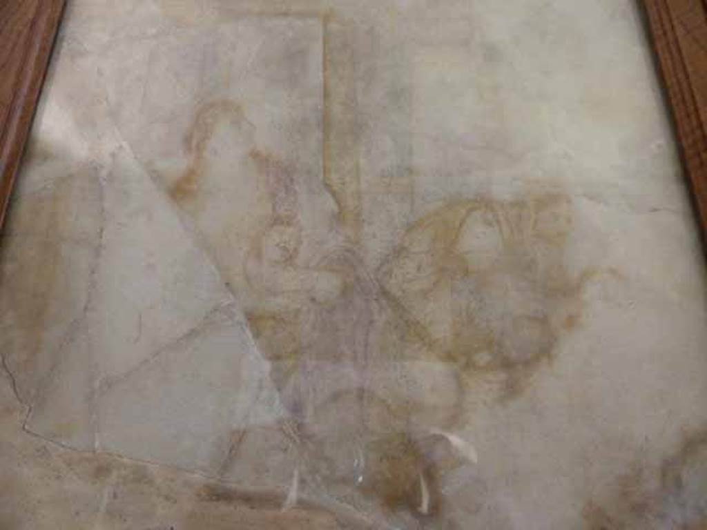 VII.15.2 Pompeii. May 2010. Sepia coloured outlines on marble. Niobe and an elderly nurse trying to protect the Queen’s young sons from the fatal arrows of Apollo and Diana. Now in the Naples Archaeological Museum. Inventory number 109370.