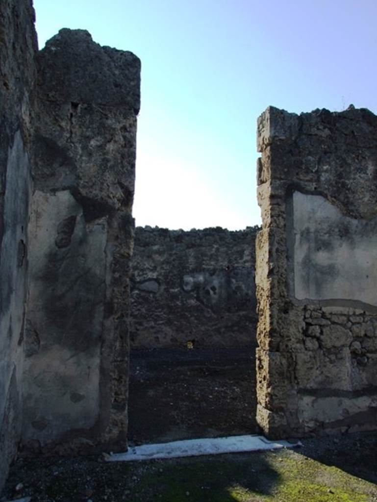 VII.15.2 Pompeii. December 2007.
First connecting doorway to atrium of VII.15.1 on west side of atrium of VII.15.2.
The painting of the “Personification of Summer” would have been to the right of the doorway.
According to PPM, seen at the south end of the west wall was one of the painted Seasons, in the middle zone on a black background, flying towards the right, was Summer.
See Carratelli, G. P., 1990-2003. Pompei: Pitture e Mosaici: Vol. VII. Roma: Istituto della enciclopedia italiana, (no.18, p. 714).
According to Sogliano, seen in the atrium was the personification of one of the Seasons, Summer. (Bull.Inst, 1872, p.167, Fiorelli, Scavi di Pompei, p.129, no.270; Descr.Pomp, (p.305).
See Sogliano, A., 1879. Le pitture murali campane scoverte negli anni 1867-79. Napoli: Giannini. (p.76, no.460)