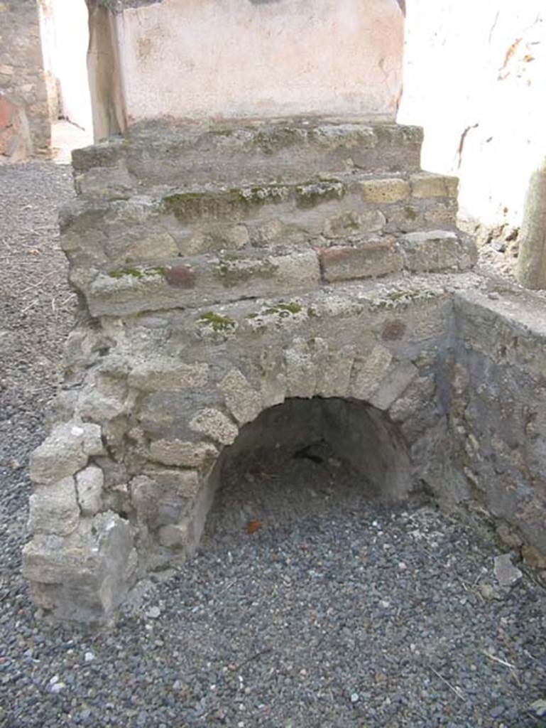VII.15.5 Pompeii. May 2003. Looking north towards display shelving at end of counter, with recess below.
Photo courtesy of Nicolas Monteix.