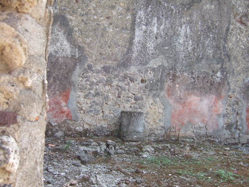 VII.15.11 Pompeii. September 2005. Garden area. Looking south towards south-east corner with remains of bench or raised planting bed.
According to Jashemski, the small garden which was excavated in 1872-3 was at the rear of the house. It had a roofed passageway on the north and west side. A low wall separated the garden from the passageway. There was a bench (or raised planting bed?) along the east and south walls. See Jashemski, W. F., 1993. The Gardens of Pompeii, Volume II: Appendices. New York: Caratzas. (p.200)