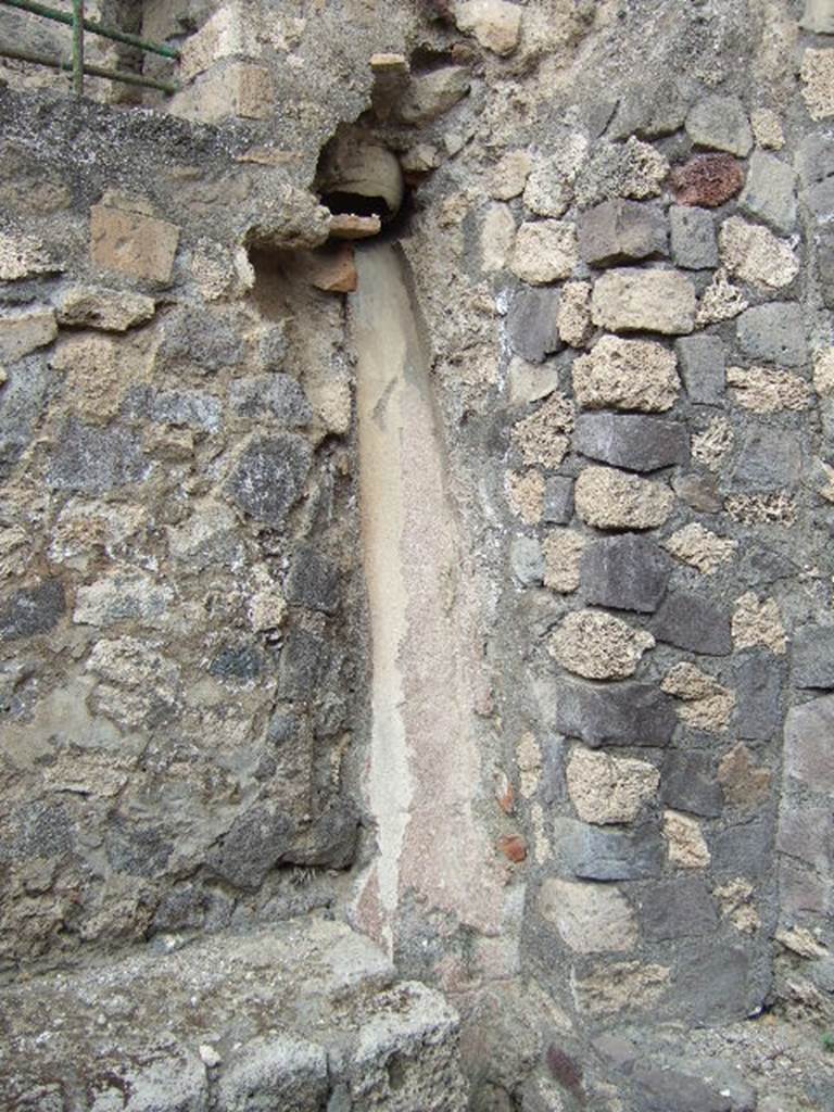VII.15.16 Pompeii. May 2006. Granary. Room C to the east of the entrance.
A wide terracotta pipe opens into the room. A long chute runs from this to the ground level.
There are platforms on either side of the chute.