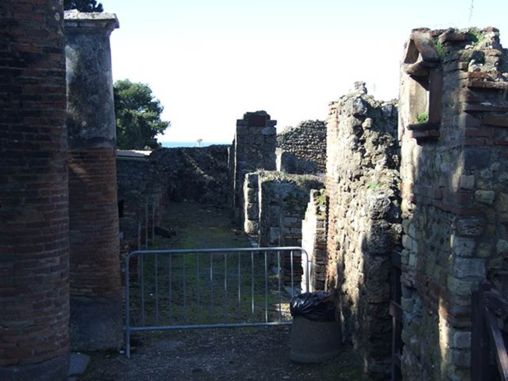 VII.16.1 Pompeii. March 2009. Looking west along the remains of the large portico. This was supported by pilasters and columns that ran along the south side of insula VII.16