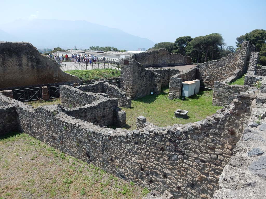 VII.16.1 Pompeii. June 2019. Looking towards wall of VII.16.3, over which can be seen the atrium of VII.16.1.
Looking south-west from rear of VII.16.10. Photo courtesy of Buzz Ferebee.