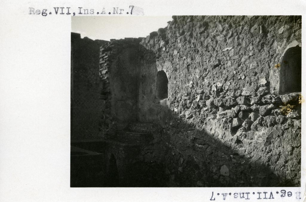 VII.16.7 Pompeii but shown as VII.A.7 on photo. Pre-1937-39.
Looking south along west wall with two arched niches, display shelving and counter.
Photo courtesy of American Academy in Rome, Photographic Archive. Warsher collection no. 1901.
